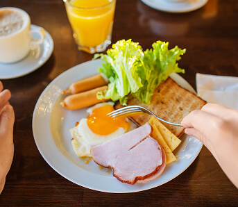 Nutritious Breakfast Plate with Eggs Ham and Toast at Assisted Living Facility Nutritious Breakfast Plate with Eggs Ham and Toast at Assisted Living Facility