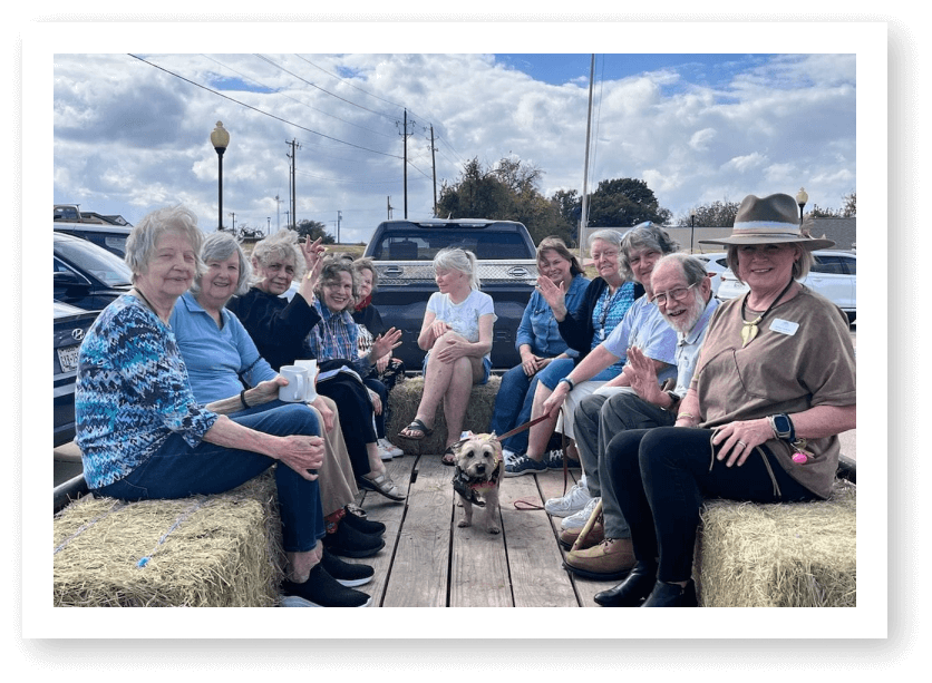 Group of Elderly Residents on Hayride Outing at Assisted Living Facility