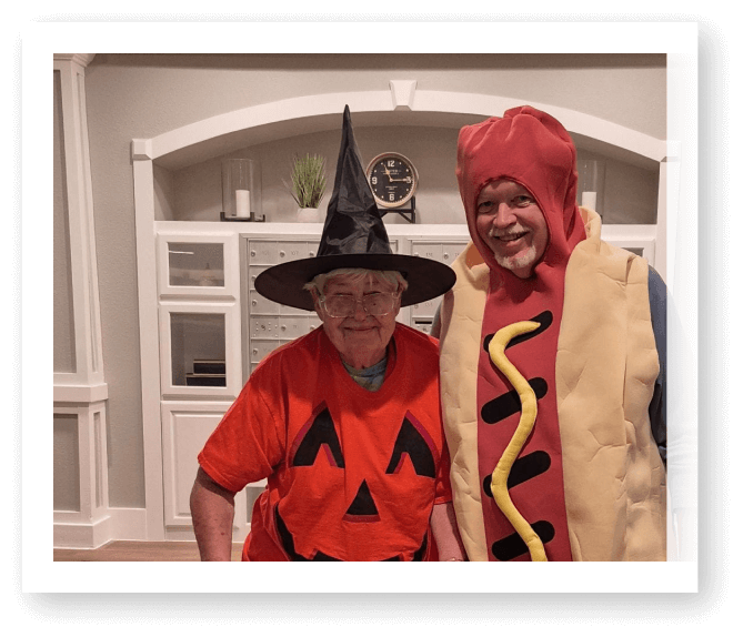 Elderly Residents Wearing Halloween Costumes for Holiday Celebration at Assisted Living Facility