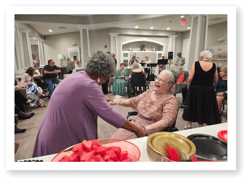 Elderly Residents Dancing and Enjoying Live Music Event at Assisted Living Facility