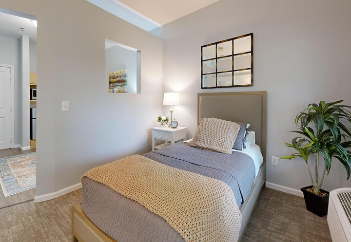 Private Bedroom with Kitchenette View for Seniors at Assisted Living Facility Private Bedroom with Kitchenette View for Seniors at Assisted Living Facility