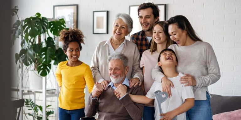 Multi-Generational Family Visiting Elderly Resident at Memory Care Facility
