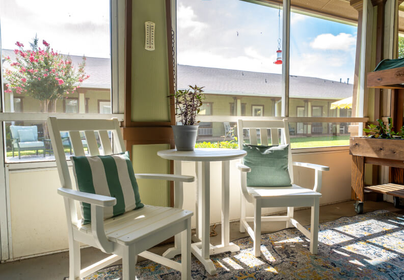 Sunny Enclosed Sunroom for Seniors at an Assisted Living Facility Sunny Enclosed Sunroom for Seniors at an Assisted Living Facility