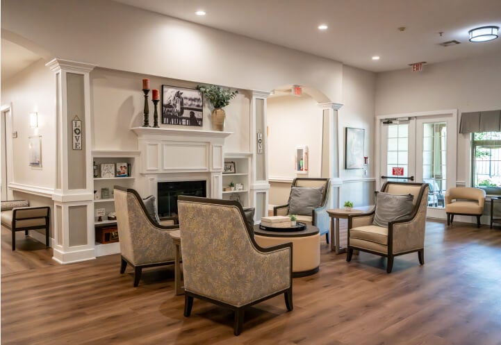 Comfortable Common Room with Fireplace for Seniors at Assisted Living Facility Comfortable Common Room with Fireplace for Seniors at Assisted Living Facility