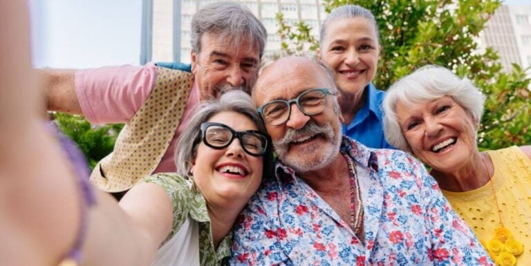 Group of Smiling Elderly Friends Taking Selfie at Assisted Living Facility